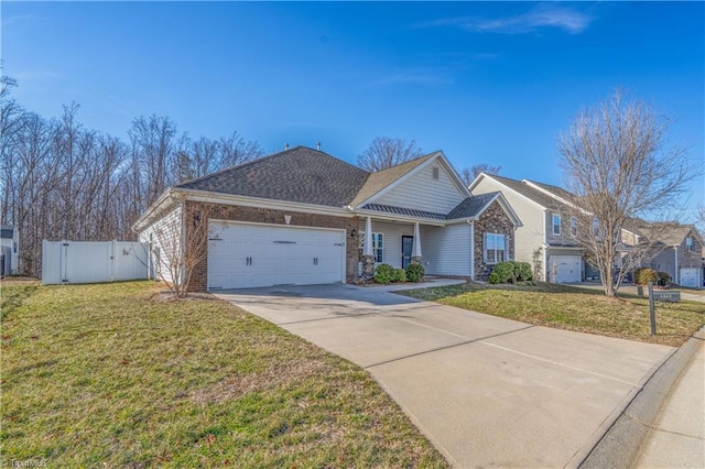 view of front of house with a garage, a front yard, concrete driveway, and fence