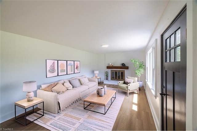 living area featuring wood finished floors and baseboards