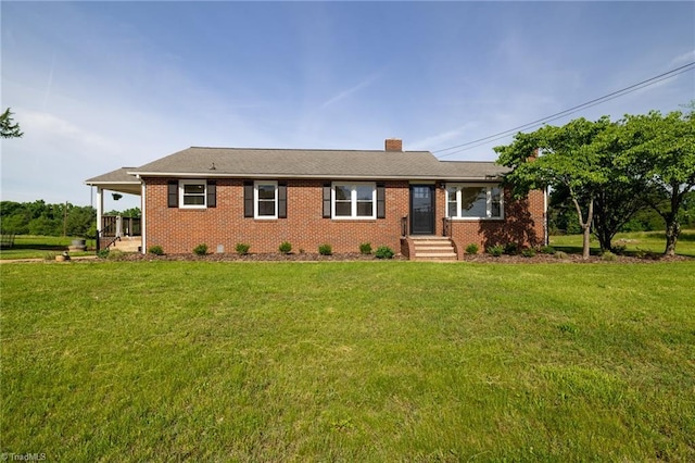 ranch-style home featuring a front yard, brick siding, and a chimney