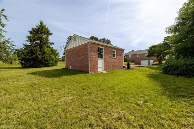 rear view of house with brick siding and a lawn