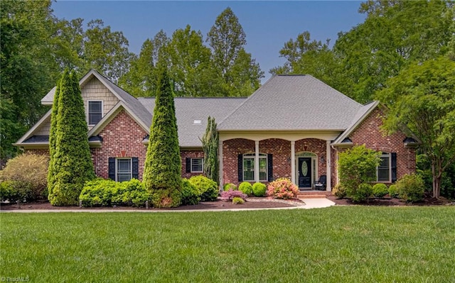 view of front facade with a front lawn and brick siding