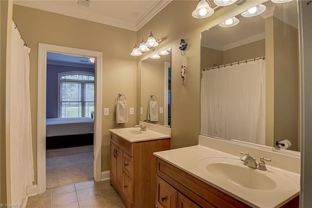 full bath with ornamental molding, tile patterned flooring, two vanities, and baseboards