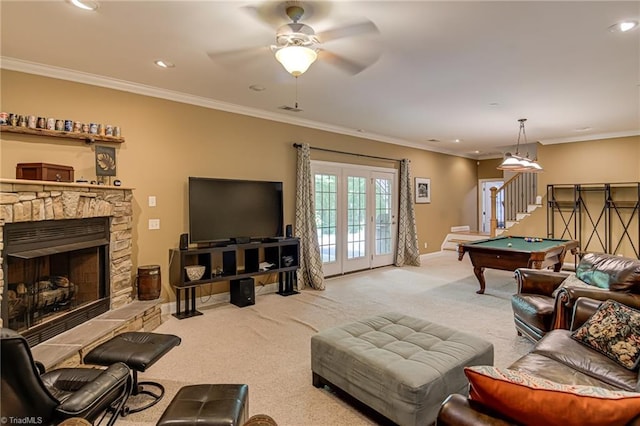 carpeted living area featuring billiards table, crown molding, recessed lighting, a stone fireplace, and baseboards