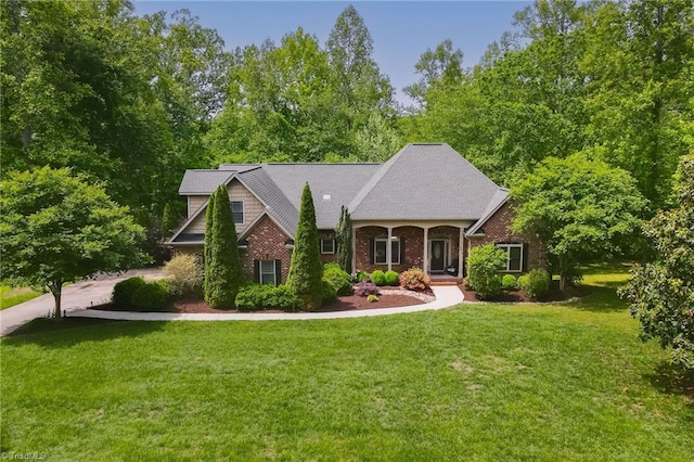 view of front facade featuring a front lawn and brick siding
