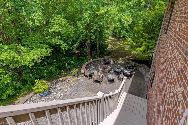wooden terrace featuring a patio