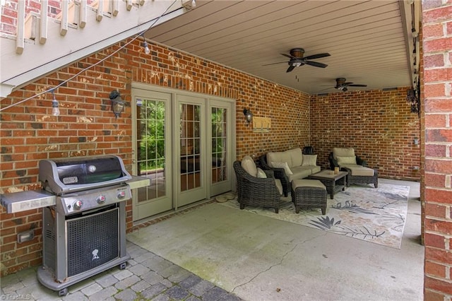 view of patio with grilling area, an outdoor living space, a ceiling fan, and french doors