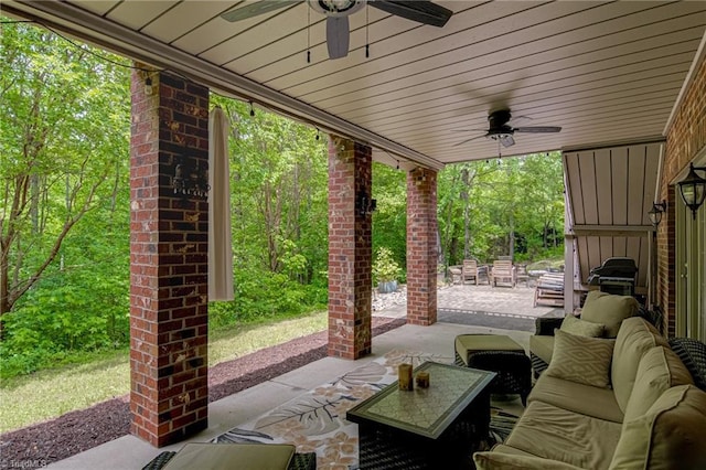 view of patio featuring a ceiling fan and an outdoor living space