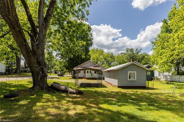 view of yard with a detached carport