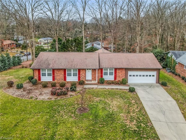 single story home with brick siding, a shingled roof, concrete driveway, a garage, and a front lawn