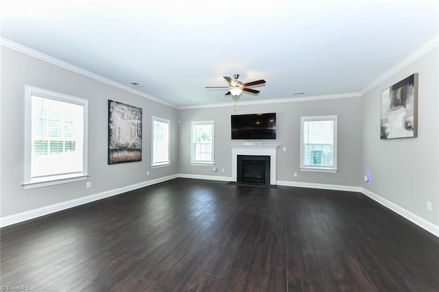 unfurnished living room featuring crown molding, ceiling fan, a fireplace with flush hearth, and dark wood-type flooring
