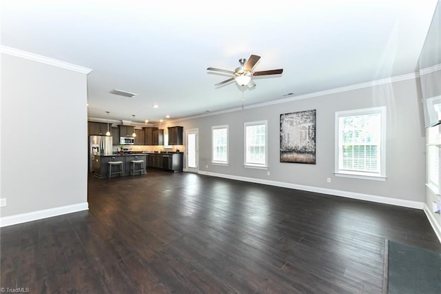 unfurnished living room featuring a ceiling fan, baseboards, ornamental molding, and dark wood-type flooring