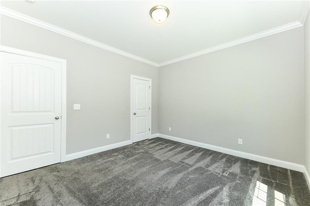 unfurnished bedroom with crown molding, baseboards, and dark colored carpet
