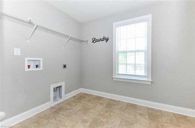 clothes washing area featuring washer hookup, baseboards, laundry area, and electric dryer hookup