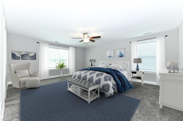 carpeted bedroom with baseboards, ceiling fan, and visible vents