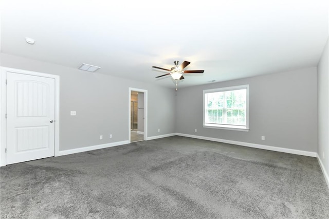 spare room featuring carpet floors, baseboards, and ceiling fan