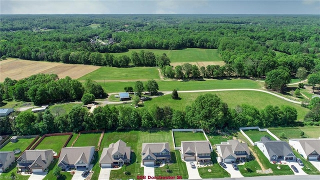 bird's eye view featuring a view of trees and a residential view