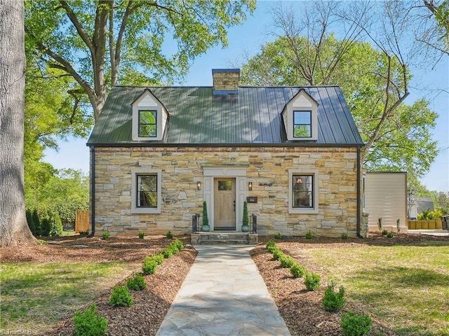 511 Circle Dr, Burlington, NC 27215 - cape cod-style house featuring a chimney, metal roof, and stone siding