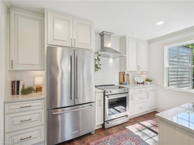511 Circle Dr, Burlington, NC 27215 - kitchen featuring wall chimney range hood, wood finished floors, light countertops, stainless steel appliances, and decorative backsplash