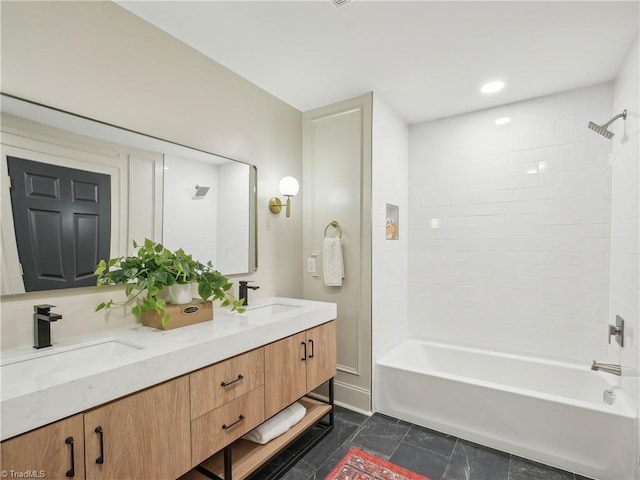 511 Circle Dr, Burlington, NC 27215 - bathroom featuring double vanity,  shower combination, and a sink
