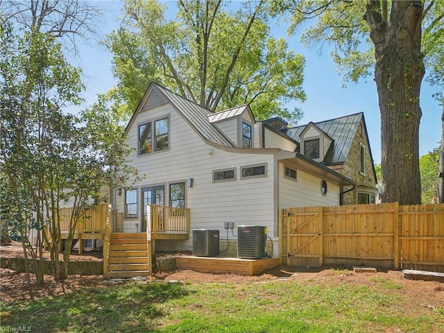 511 Circle Dr, Burlington, NC 27215 - back of property featuring stairs, a deck, central air condition unit, and fence