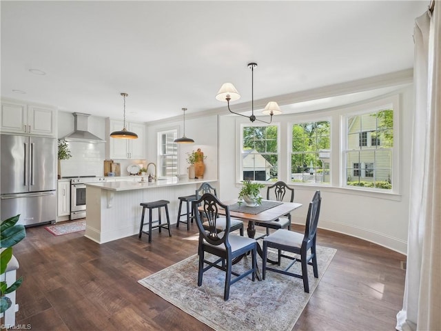 511 Circle Dr, Burlington, NC 27215 - dining area with baseboards and dark wood-style floors