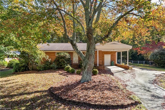 single story home with a carport