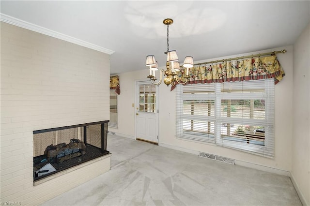 carpeted dining room featuring an inviting chandelier, ornamental molding, and a multi sided fireplace