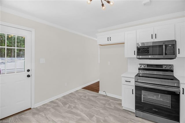4126 Old Way Rd, Sophia, NC 27350 - kitchen with appliances with stainless steel finishes, ornamental molding, white cabinets, and light countertops