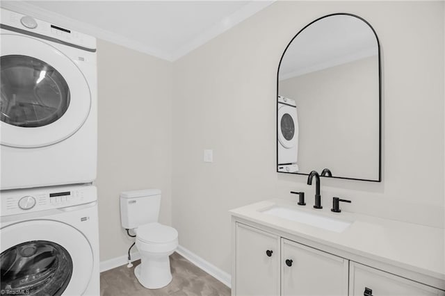 4126 Old Way Rd, Sophia, NC 27350 - bathroom featuring stacked washing machine and dryer, vanity, and ornamental molding