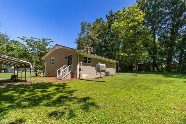 4126 Old Way Rd, Sophia, NC 27350 - back of property with a lawn, a chimney, a carport, and stucco siding