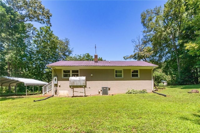 4126 Old Way Rd, Sophia, NC 27350 - back of house featuring a detached carport, a yard, brick siding, and a metal roof