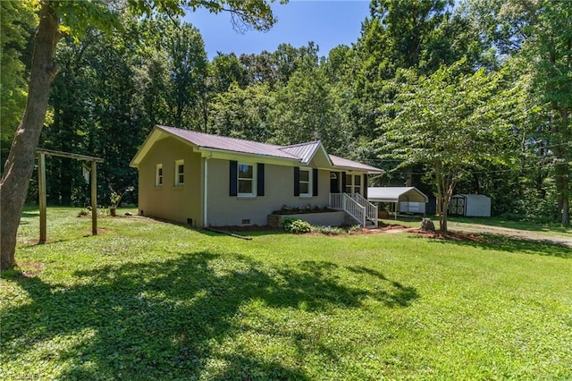 4126 Old Way Rd, Sophia, NC 27350 - ranch-style house featuring a carport, a storage unit, a porch, a front lawn, and a metal roof