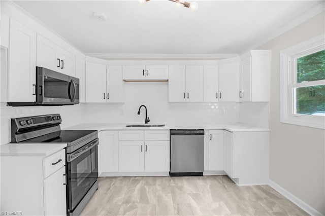 4126 Old Way Rd, Sophia, NC 27350 - kitchen with stainless steel appliances, light countertops, and white cabinetry