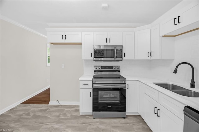 4126 Old Way Rd, Sophia, NC 27350 - kitchen featuring appliances with stainless steel finishes, crown molding, decorative backsplash, and white cabinets