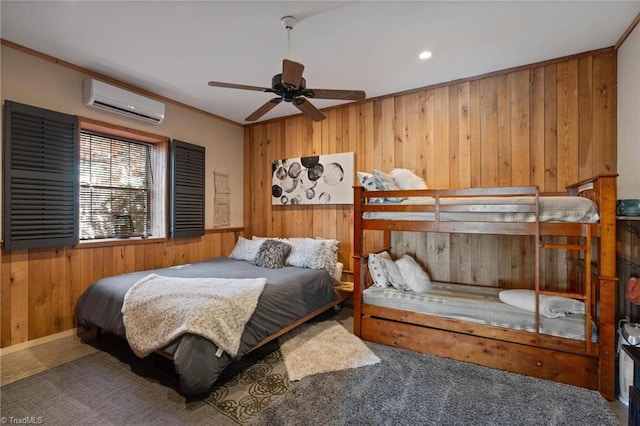 carpeted bedroom featuring wooden walls and a wall mounted air conditioner