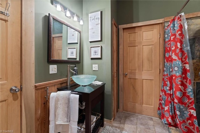 full bathroom with vanity and a shower with curtain