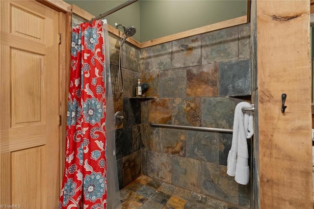 full bath with a tile shower