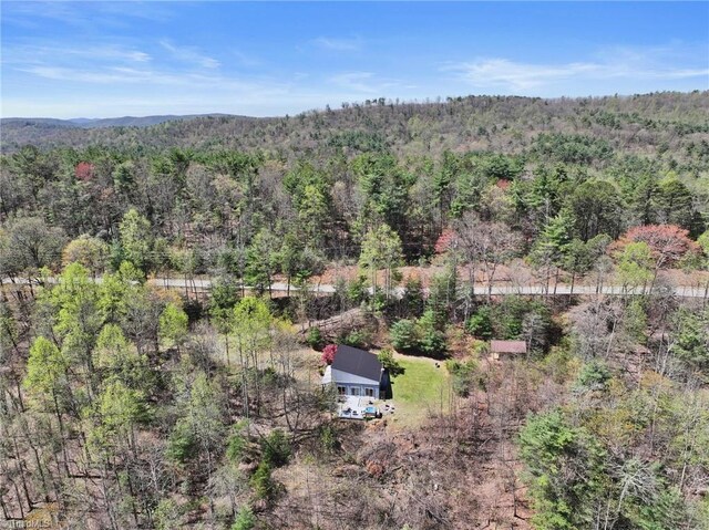 aerial view featuring a view of trees
