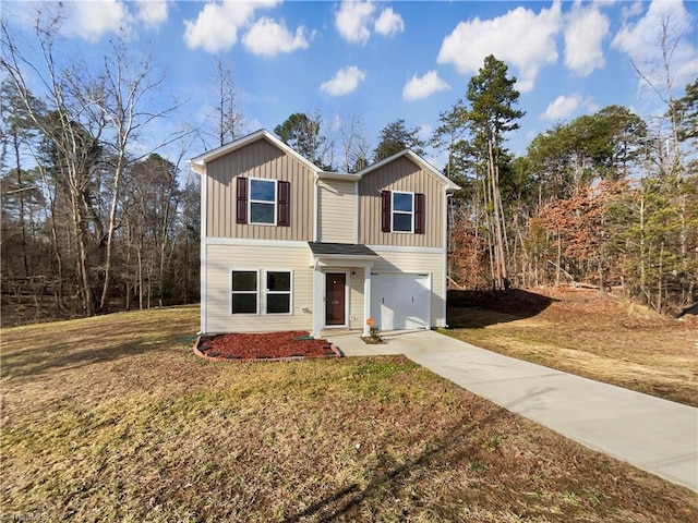 view of front of property with a front lawn and a garage