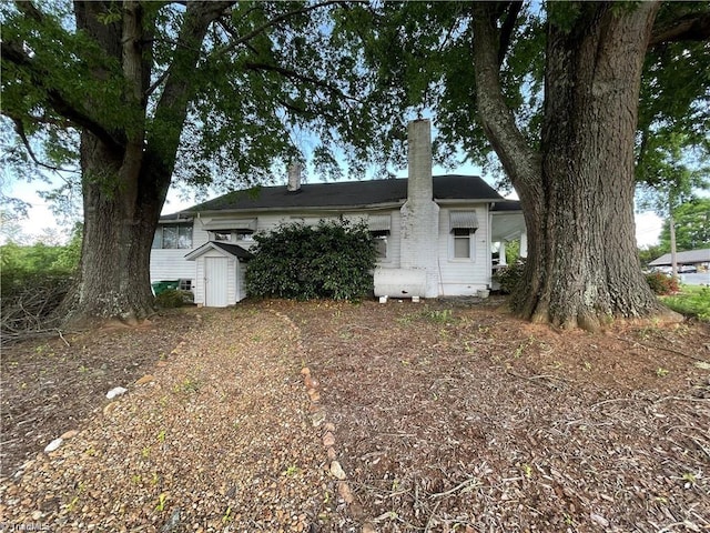 view of home's exterior with a shed