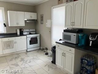 kitchen featuring crown molding, white cabinets, and white stove