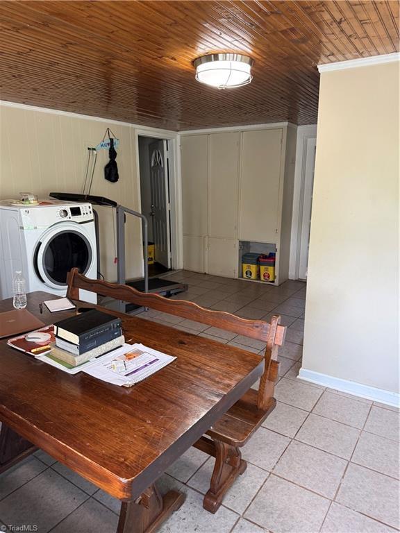 501 N 3rd Ave, Mayodan, NC 27027 - dining space featuring light tile patterned flooring, wooden ceiling, and washer / clothes dryer