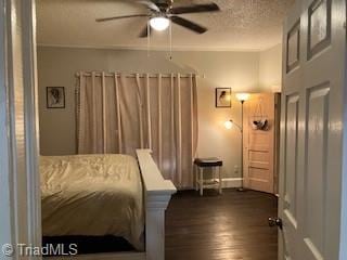 bedroom with dark hardwood / wood-style flooring and a textured ceiling