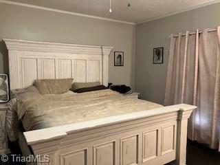 bedroom featuring crown molding