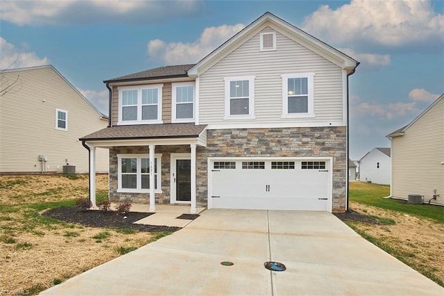 view of front facade with central air condition unit, a front lawn, and a garage