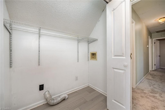 laundry area with hookup for a washing machine, laundry area, visible vents, baseboards, and electric dryer hookup