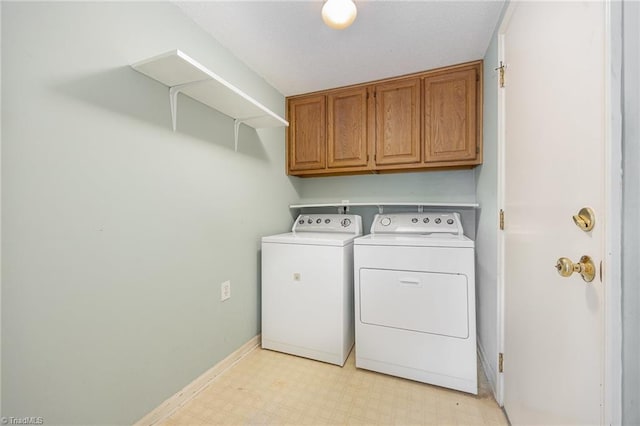 1808 Dunleith Way, Greensboro, NC 27455 - washroom featuring washing machine and dryer, light flooring, cabinet space, and baseboards