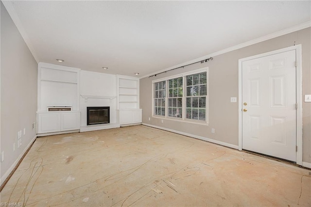 1808 Dunleith Way, Greensboro, NC 27455 - unfurnished living room with ornamental molding, baseboards, built in shelves, and a glass covered fireplace