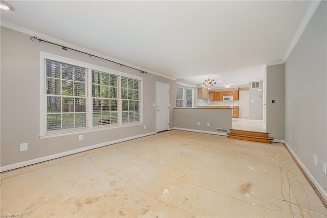 1808 Dunleith Way, Greensboro, NC 27455 - unfurnished living room with crown molding, a chandelier, and baseboards