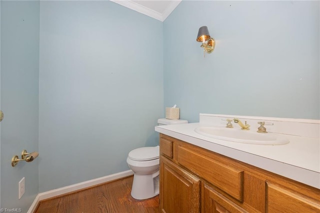 1808 Dunleith Way, Greensboro, NC 27455 - half bath featuring crown molding, toilet, wood finished floors, vanity, and baseboards
